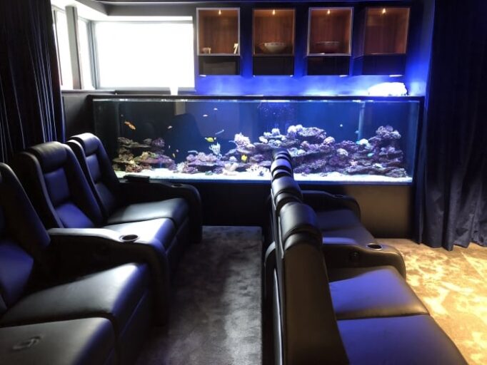 Large saltwater aquarium in home cinema room